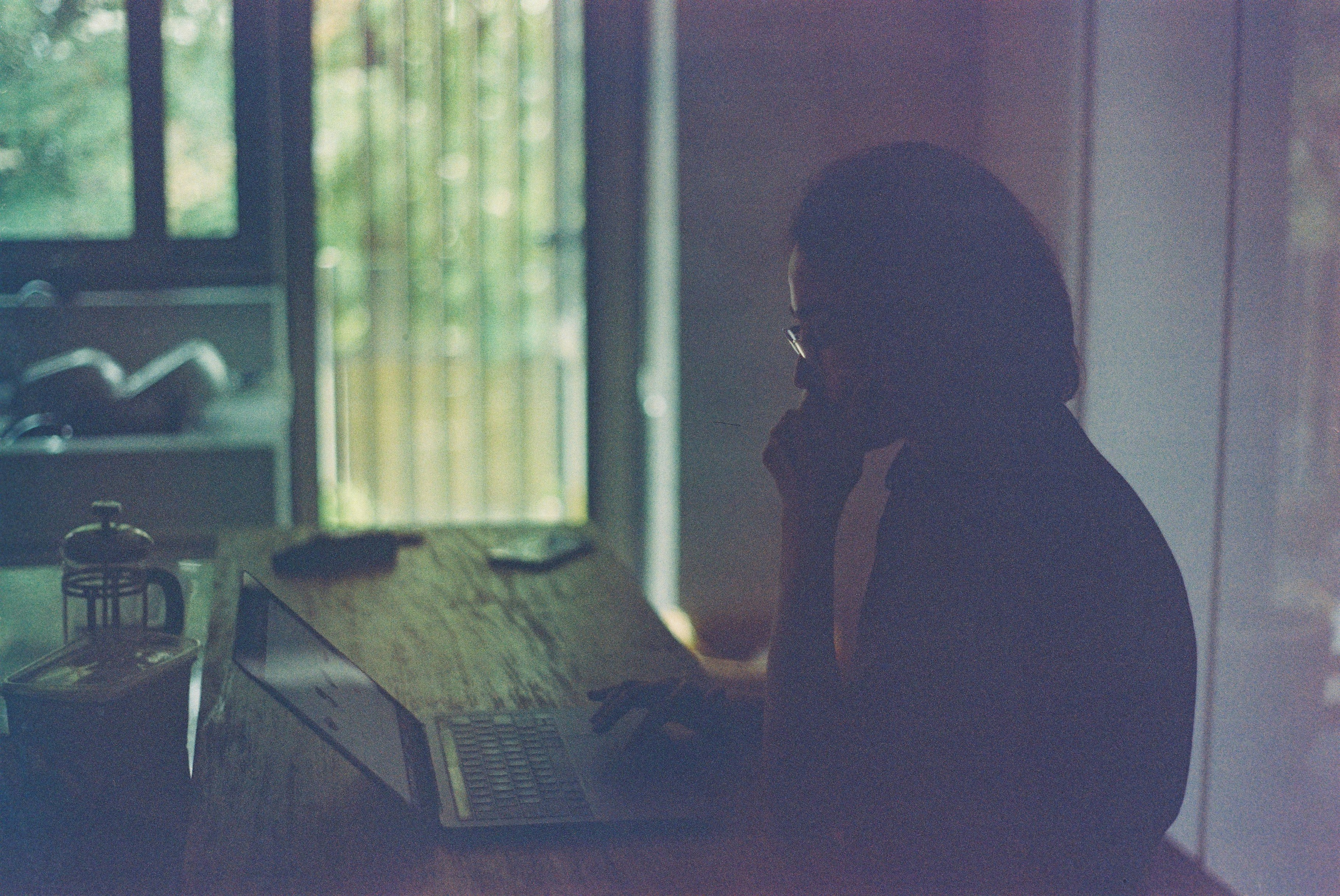 silhouette of woman sitting on chair